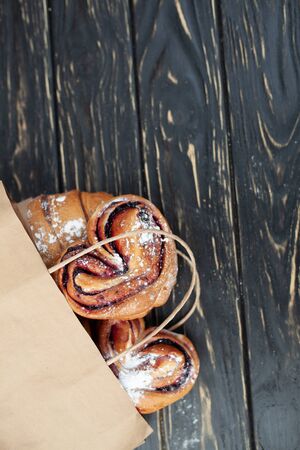 Mock up. Healthy tasty breakfast. Top view, copy space. Bakery on the white Wooden background. French breakfast. Paper package. Breakfast food table.の写真素材