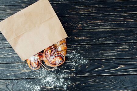 Mock up. Healthy tasty breakfast. Top view, copy space. Bakery on the white Wooden background. French breakfast. Paper package. Breakfast food table.の写真素材