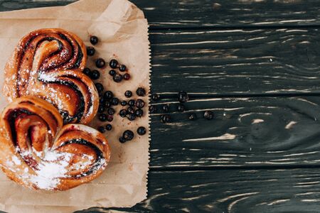 Rustic with black current berry filling pie on black wooden table background. Tasty breakfast. Bakery Fresh Healthy breakfast. Unhealthy food with glutenの写真素材