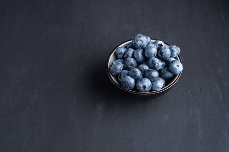 Blueberry antioxidant organic superfood in a bowl concept for healthy eating and dieting nutrition Top view. の写真素材