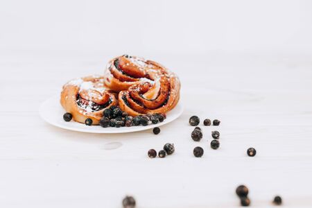 Rustic with black current berry filling pie on white wooden table background. Tasty breakfast. Bakery Fresh Healthy breakfast. Unhealthy food with glutenの写真素材