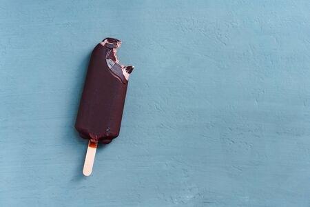 ice cream stick  on dark  background  covered chocolate sticks frozen ice Lolly sweet dessert  Flat lay Summer deliciousの写真素材