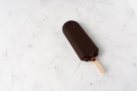 ice cream stick  on dark white background  covered chocolate sticks frozen  Lolly sweet dessert  Flat lay Summer deliciousの写真素材