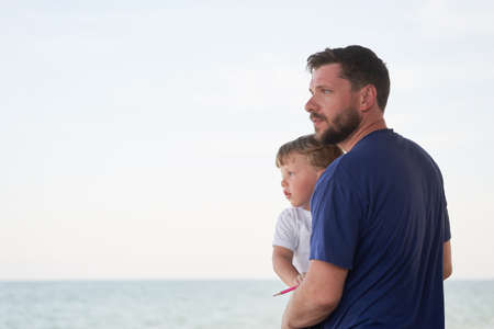 Father son spending time together sea vacation Young dad child little boy walking beach Fathers day....