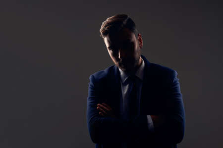 Close up portrait young unrecognizable man businessman Caucasian guy business suit studio gray...
