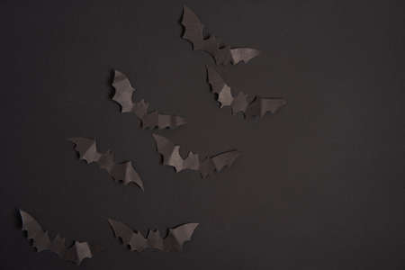 Halloween decoration concept black paper bats black cardboard background With copy space for tetxtの写真素材