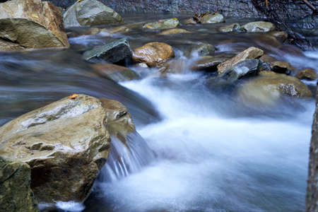 Mountain river with blured water close up Long exposureの写真素材