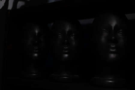 Black mannequin head on black background modern fashion abstract background Dark dummy headの写真素材
