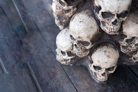 Skull Halloween Background Many People Skulls Stand on top of each other. Mystic creepy concept. Abstract nightmare occult memorial.の写真素材