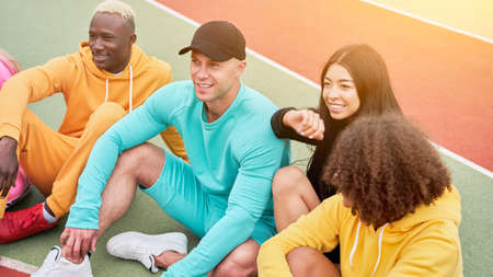 Multi-ethnic group teenage friends. African-american asian caucasian student spending time together...