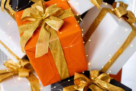 Christmas present gift box stacked close up. Holiday sale concept. Many gift box black, white,...