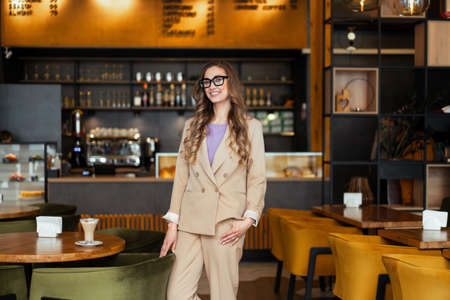 Business Woman Restaurant Owner Dressed Elegant Pantsuit Standing In Restaurant With Bar Counter...