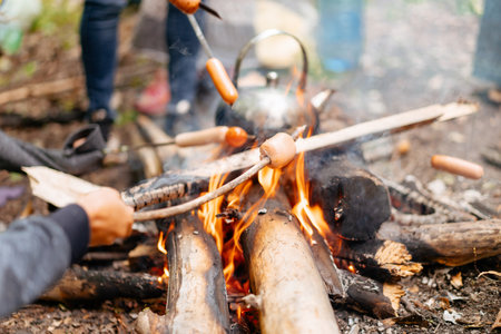 Teapot Sauasge Grilled Campfire On Nature Picnic Bonfire Preparing Food Forest Hikingの写真素材