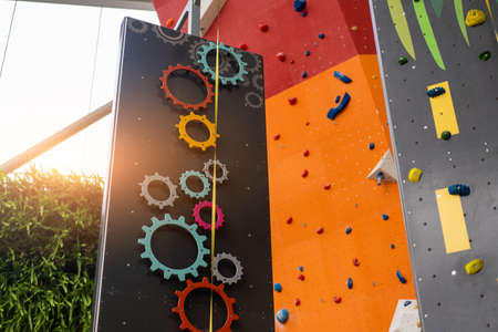 Indoor bouldering and climbing wall for training at modern gym. Gears and toy climbing wall for children extreme sportの写真素材