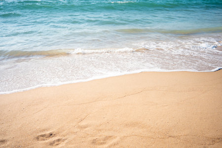Soft beautiful ocean wave on sandy beach. background. Turquoise color sea view with copy spaceの写真素材