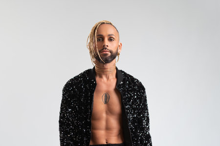 Trendy black latin gay man in fashionable clothes look camera isolated on white background studio portrait People lifestyle fashion lgbtq conceptの写真素材