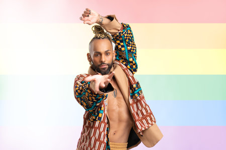 Portrait Trendy black latin gay man in fashionable clothes dancing isolated on white background...