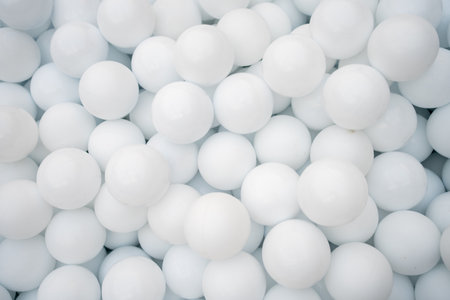 Many white plastic balls for dry pool in amusement parkの写真素材