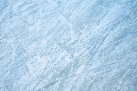 Winter frost patterns on glass. Ice crystals or cold winter background. Frozen snow window. Blue ice...