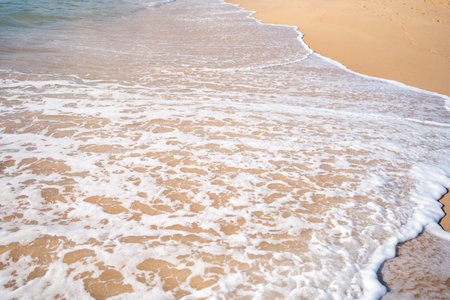 Soft beautiful ocean wave on sandy beach. Background. Turquoise color sea view with copy spaceの写真素材