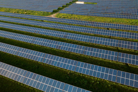 Solar farm with rows of panels on field, highlighting renewable energys role in reducing pollution...
