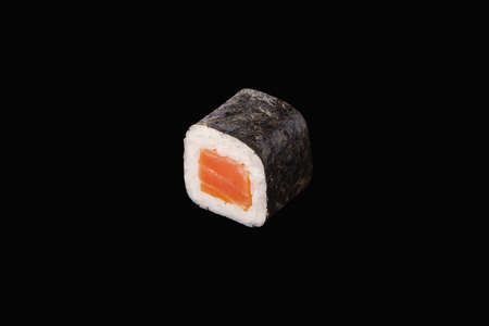 hosomaki roll with smoked salmon isolated on blackの写真素材