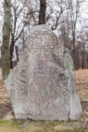 Ancient Nordic Runestone Standing in the Forest Close to Karlberg Castle Swedenのeditorial素材