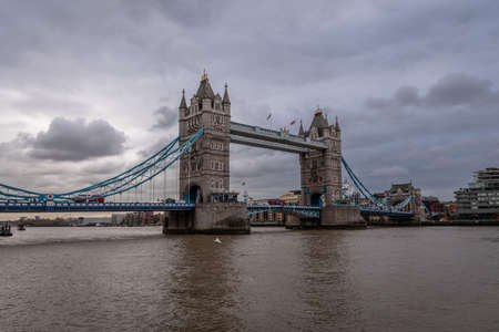 LONDON, ENGLAND, DECEMBER 10th, 2018: Tower Bridge in London, the UK. Sunrise with beautiful clouds. English symbolsのeditorial素材