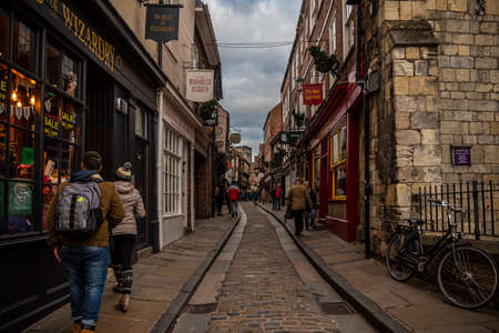 YORK, ENGLAND, DECEMBER 12, 2018: people walking in the famous The Shambles streetのeditorial素材