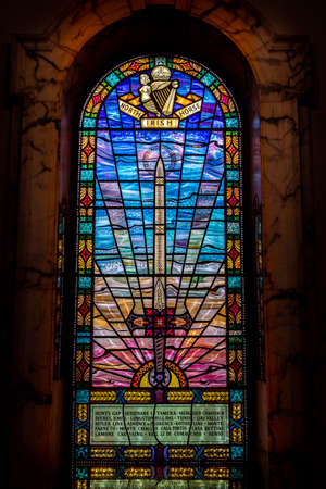 BELFAST, NORTHERN IRELAND, DECEMBER 19, 2018: Detail of stained glass window from inside of Belfast City Hall, showing a beautiful and colorful ornamental swordのeditorial素材