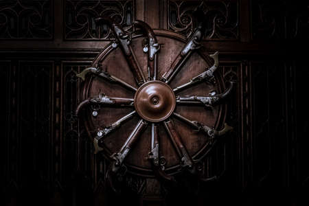 EDINBURGH, SCOTLAND, DECEMBER 15, 2018: Claymores and Flintlock Pistols on one of the walls inside of Great Hall at Edinburgh Castleのeditorial素材