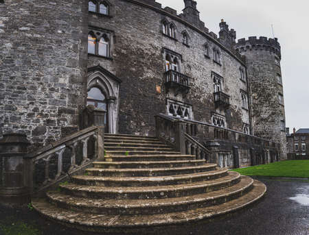 KILKENNY, IRELAND, DECEMBER 23, 2018: Panoramic view of Kilkenny Castle entrance staircase on a dramatic cloudy dayのeditorial素材