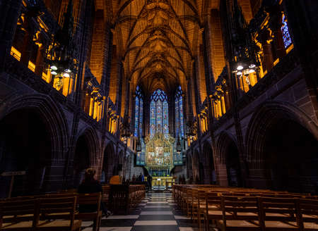 LIVERPOOL, ENGLAND, DECEMBER 27, 2018: The Lady Chapel in Liverpool Anglican Cathedral. Perspective view of a magnificent part inside the church, where light meets darkness all along place.のeditorial素材