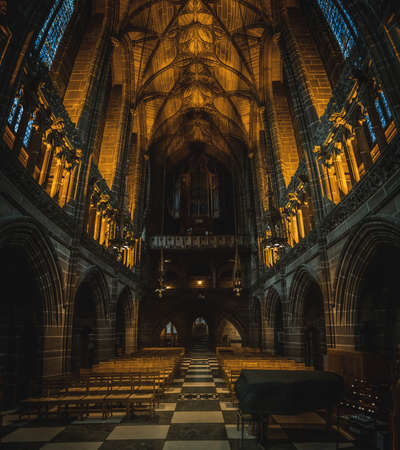 LIVERPOOL, ENGLAND, DECEMBER 27, 2018: The Lady Chapel in Liverpool Anglican Cathedral. Panoramic view of a magnificent part inside the church, where light meets darkness all along place.のeditorial素材