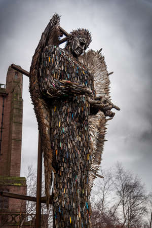 LIVERPOOL, ENGLAND, DECEMBER 27, 2018: Sculpture of an angel made with all kind of knives at the entrance of the Church of England Anglican Cathedral of the Diocese of Liverpoolのeditorial素材