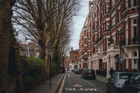 LONDON, ENGLAND, DECEMBER 29, 2018: Facades in London on quietly street with signs of slow speed for school crossingのeditorial素材