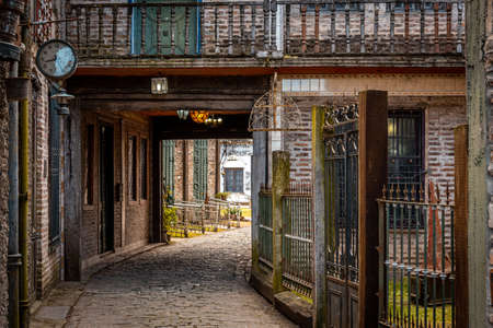 GONZALEZ CATAN, ARGENTINA, SEPTEMBER 28, 2019: cobblestone path through abandoned buildings in the amazing medieval town of Campanopolisのeditorial素材