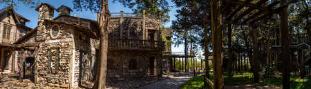 GONZALEZ CATAN, ARGENTINA, SEPTEMBER 28, 2019: cobblestone path through abandoned buildings in the amazing medieval town of Campanopolisのeditorial素材
