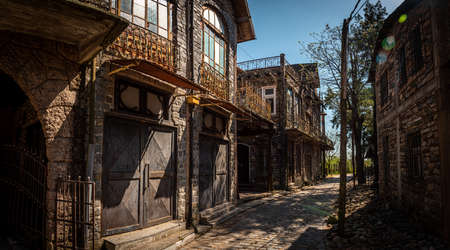 GONZALEZ CATAN, ARGENTINA, SEPTEMBER 28, 2019: cobblestone path through abandoned buildings in the amazing medieval town of Campanopolisのeditorial素材