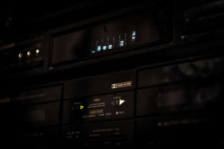 BARILOCHE, ARGENTINA, JUNE 18, 2019: Close up of old stereo music sound system with graphic volume equalizer glowing in the darkのeditorial素材