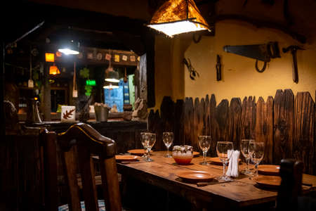 Interior of a beautiful and cozy irish pub, full of drinks, beers and food to spend a good timeの写真素材