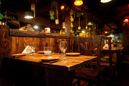 Interior of a beautiful and cozy irish pub, full of drinks, beers and food to spend a good timeの写真素材