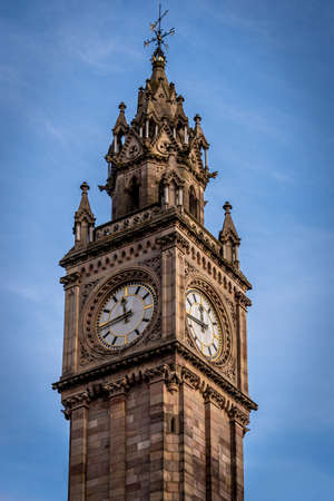 BELFAST, NORTHERN IRELAND, DECEMBER 19, 2018: Close up of Albert Memorial Clock Tower situated at Queen's Square in Belfast. It was completed in 1869 and is one of the best known landmarks of Belfastのeditorial素材