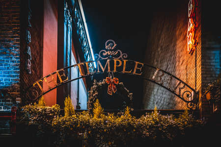 DUBLIN, IRELAND, DECEMBER 24, 2018: Temple Bar historic district, known as cultural quarter with lively nightlife. Nightscene of the bar, full of neon lights and its typically irish pub lookのeditorial素材