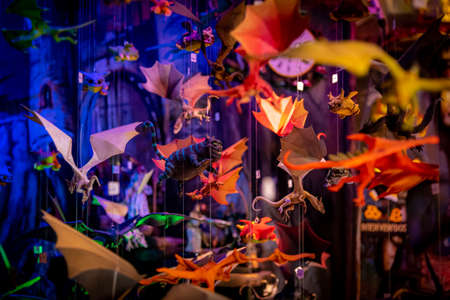 Cheshire cat and other colorful hanging toys of flying characters from movies of magic and fantasy on a shallow depth of field.のeditorial素材