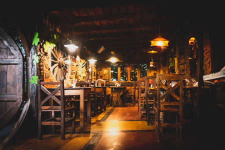 Interior of a beautiful and cozy irish pub, full of drinks, beers and food to spend a good time.のeditorial素材