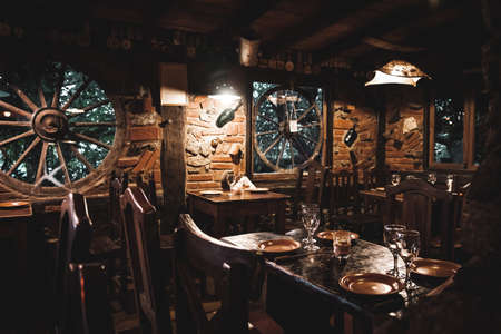 Interior of a beautiful and cozy irish pub, full of drinks, beers and food to spend a good time.のeditorial素材
