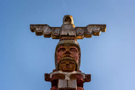 VILLA GESELL, ARGENTINA, DECEMBER 12, 2020: Close up of stone figure of a totem with an eagle at the entrance of the beach townのeditorial素材