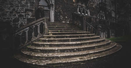KILKENNY, IRELAND, DECEMBER 23, 2018: Kilkenny Castle stone entrance staircase seen from below on a dark spooky evening.のeditorial素材