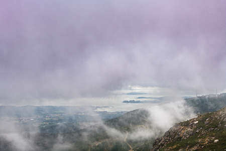 Aerial view of the Ria de Arousa estuary from the Muralla mountain on a foggy Summer afternoon, with...